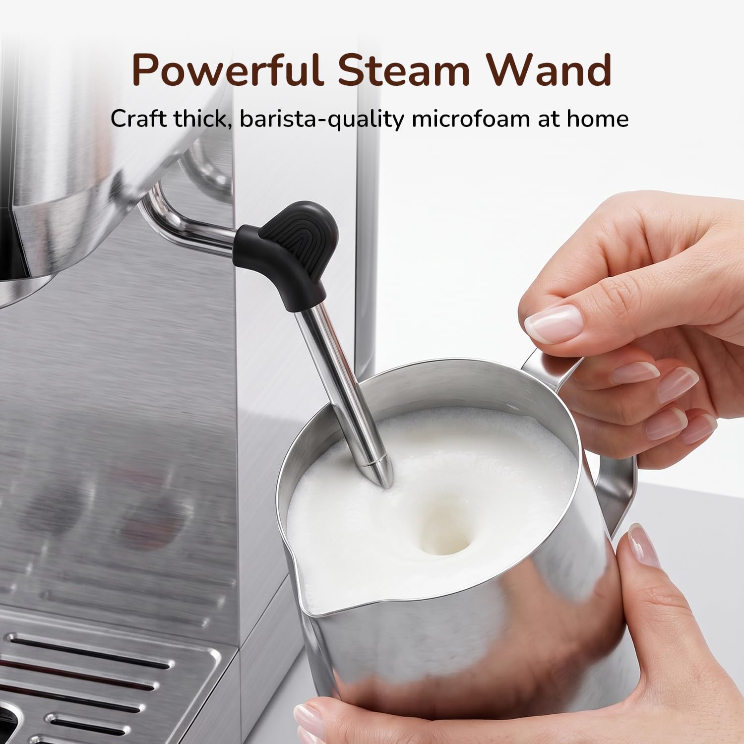 Hand frothing milk with the powerful steam wand of the Canoly espresso machine