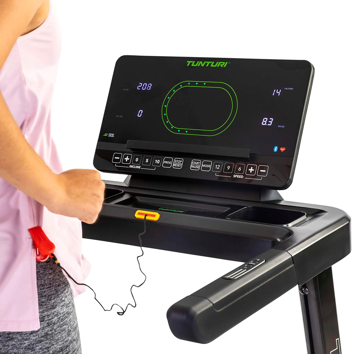 Close-up of the Tunturi T20 treadmill console, highlighting the safety key mechanism and control buttons, with a user's hand nearby.