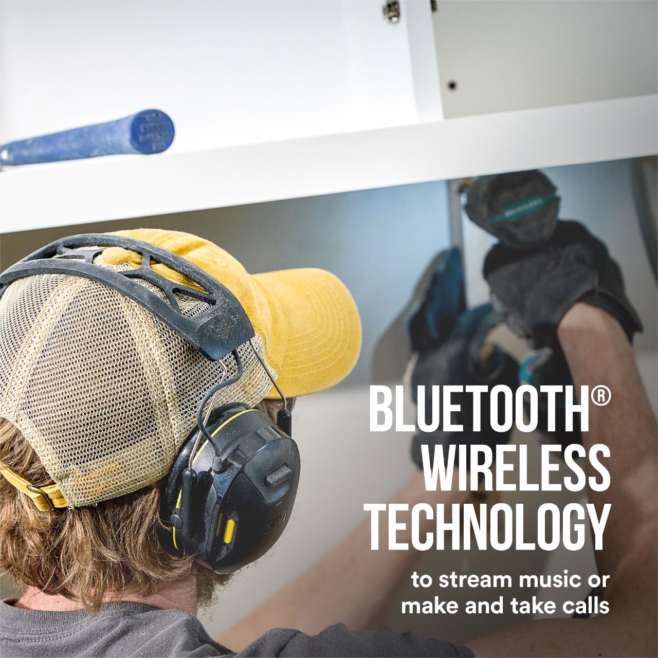 Person wearing 3M WorkTunes Connect headset, using Bluetooth wireless technology