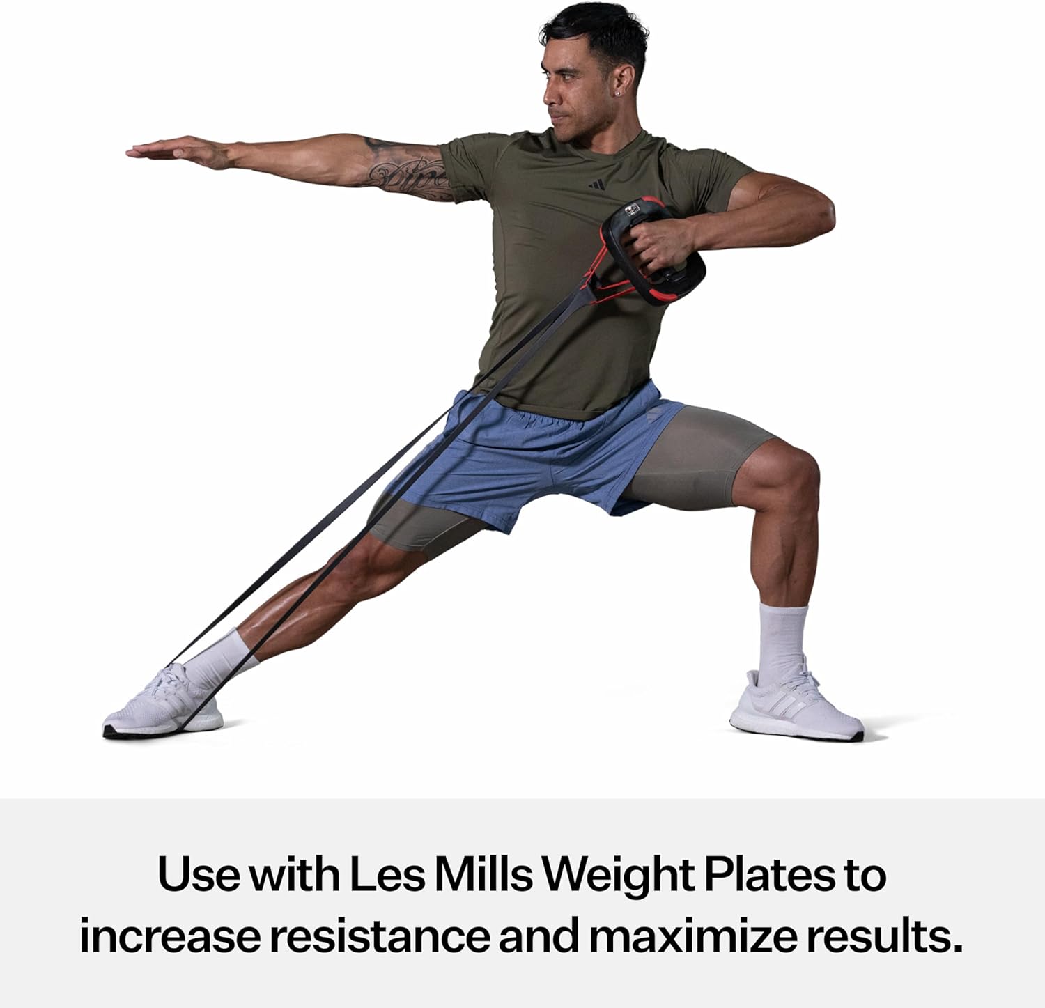 Man performing a resistance band exercise with Les Mills weight plates