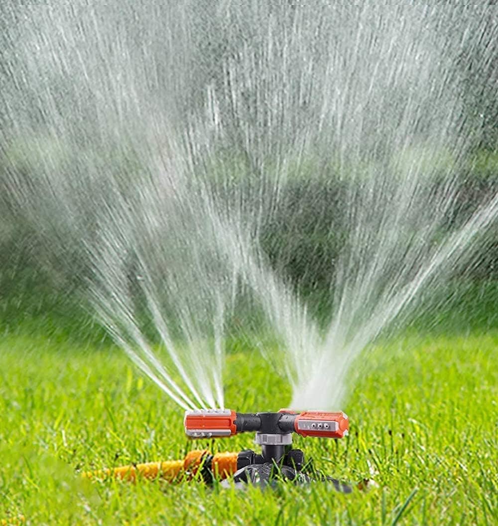 Garden sprinkler in operation, showing water spraying in a wide, even pattern