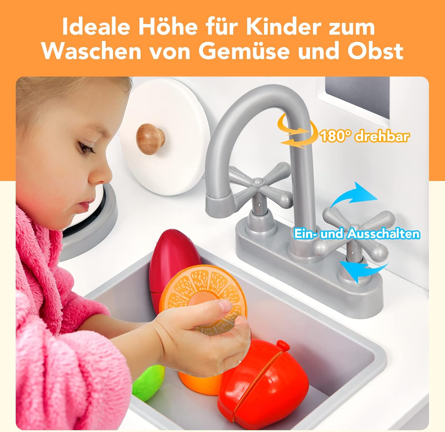 A child playing with the sink and faucet of the wooden play kitchen.