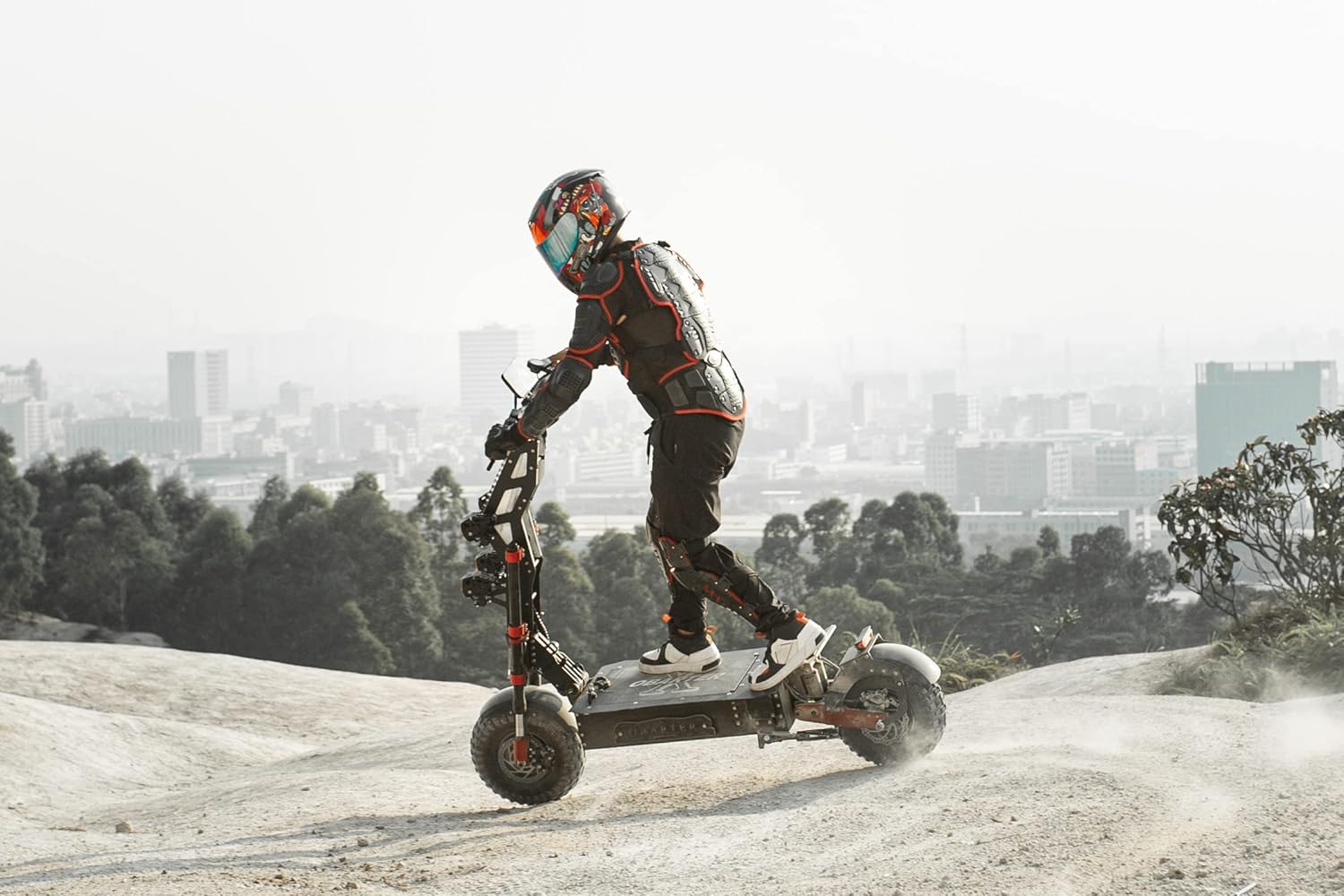 Rider on OBARTER X7 Electric Scooter on off-road terrain