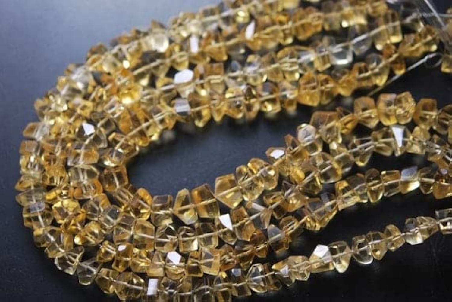 Citrine dorée facettée : perles de luxe 7-10mm pour bijoux d'exception