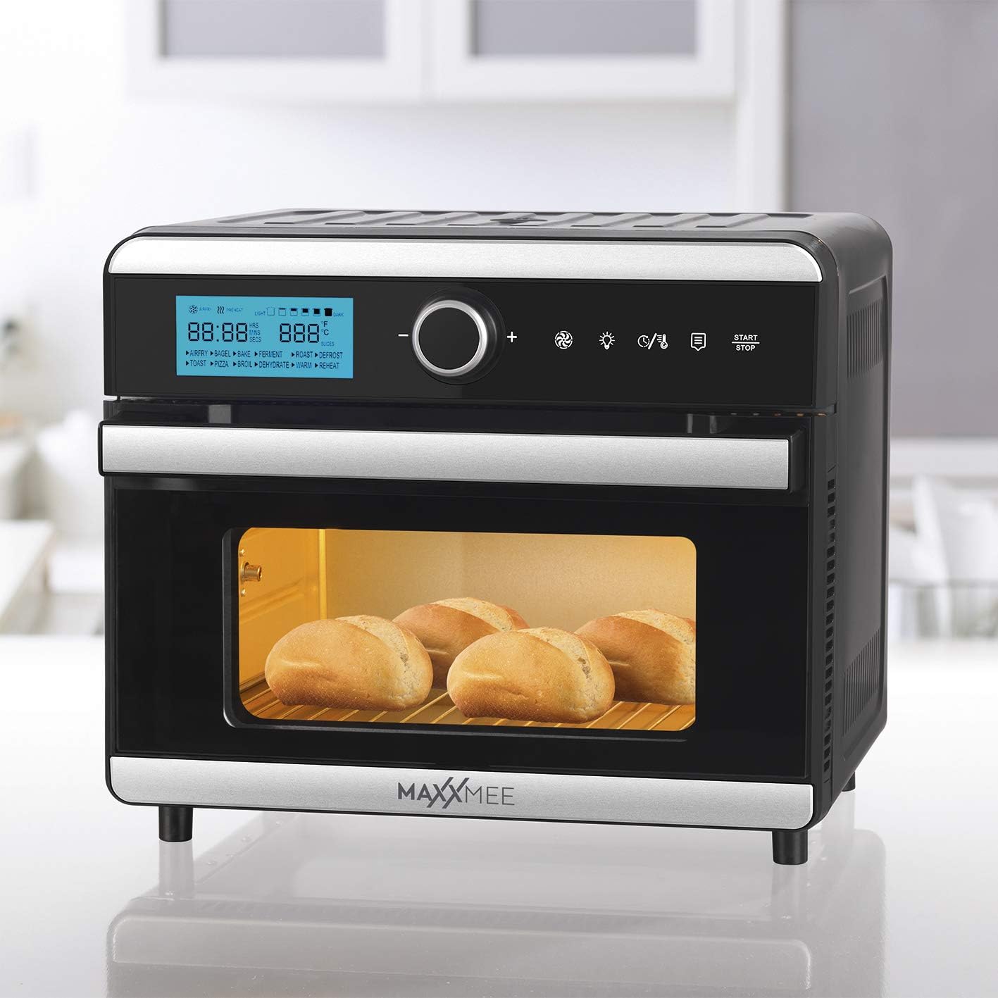 Several bread rolls baking on a rack inside the MAXXMEE Digital Hot Air Oven.