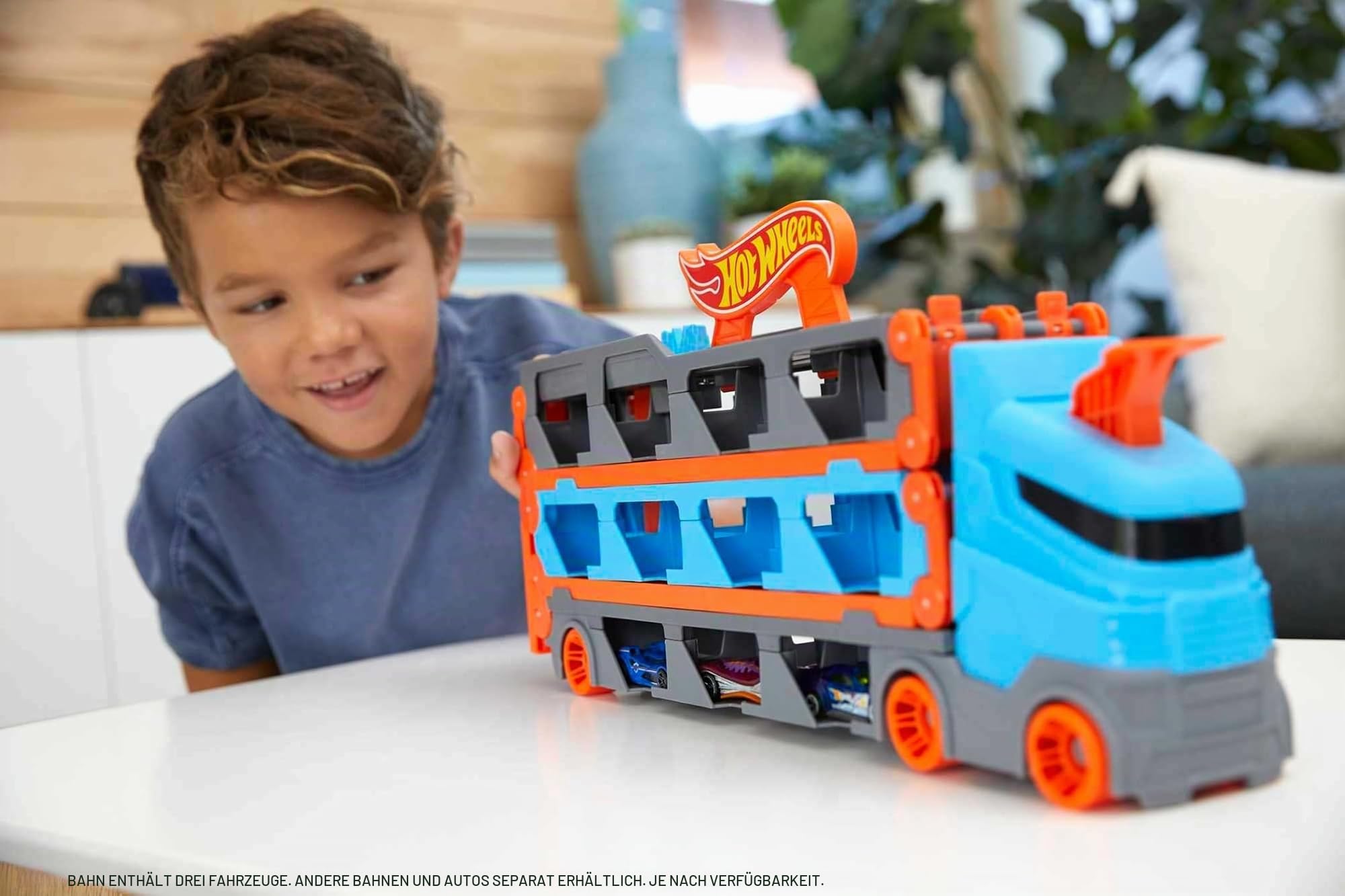 Hot Wheels 2:1 Autorennbahn zu Transporter, inkl. 3 Spielzeugautos, mit Doppelstarter, Auslösefunktion und Weiche, Platz für 20 Autos, Spielzeug ab 4 Jahre, GVG37
