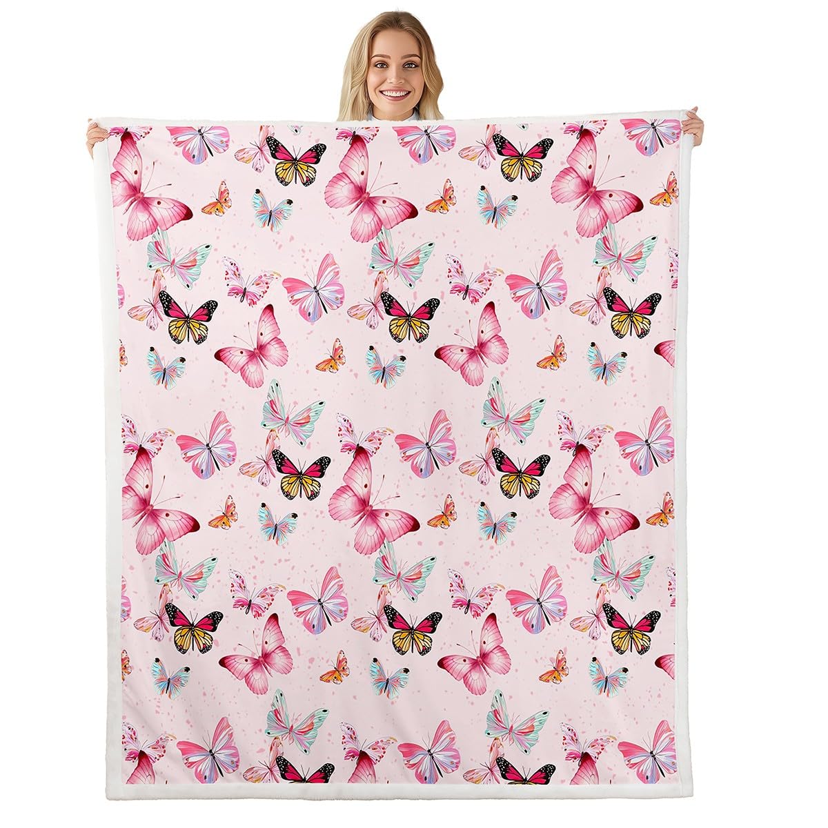 Couverture polaire rose aux papillons pour se blottir au chaud sur le canapé