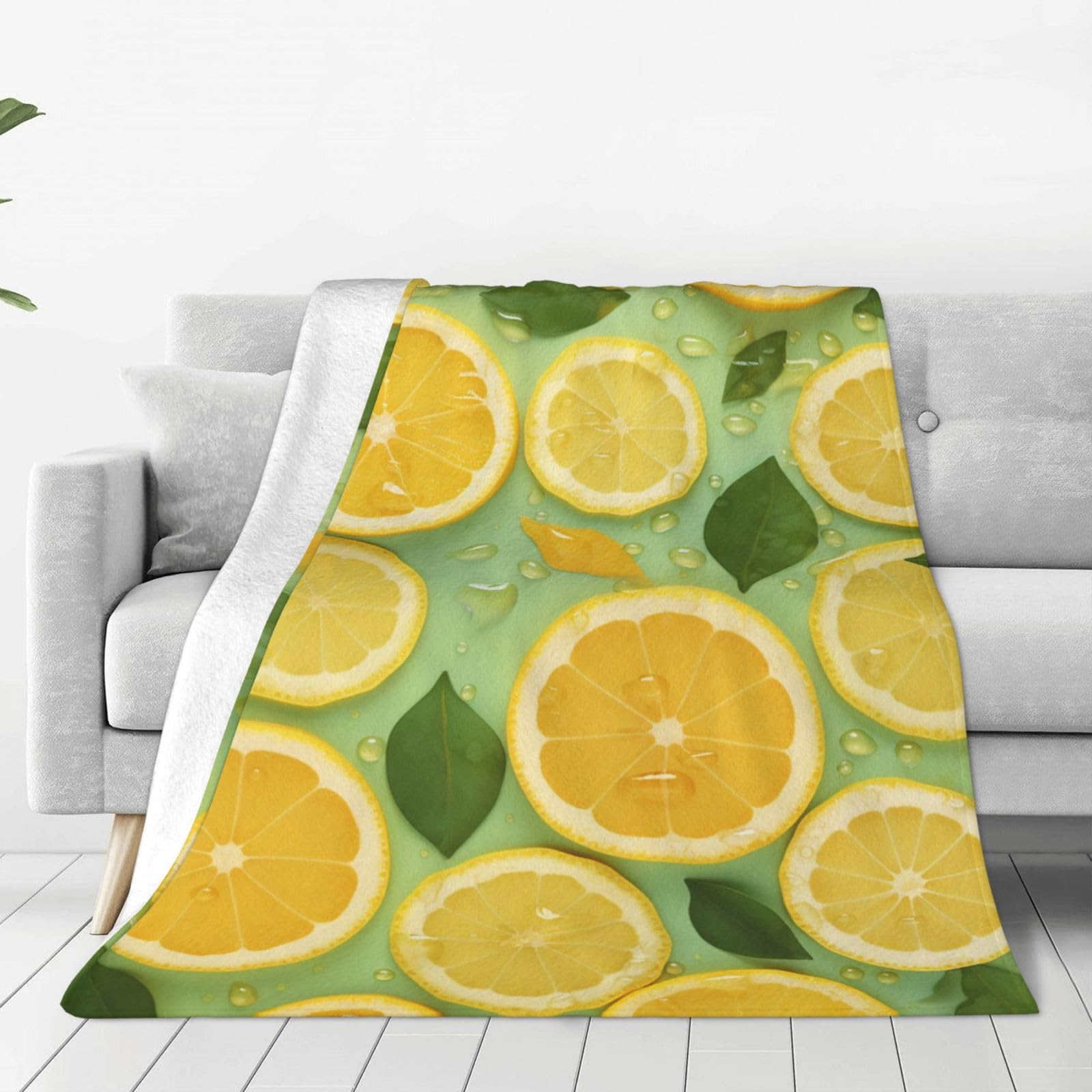 Couverture citron en micro polaire pour des moments cocooning sur votre canapé