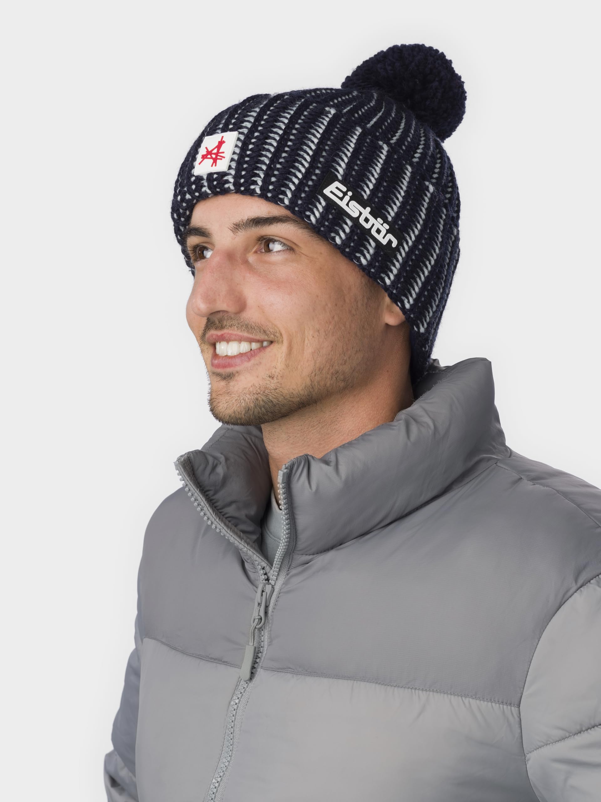 Eisbär Mütze Herren & Damen Ronda Pompon Ski Austria - Merino Wintermütze Unisex mit Fleece schützt vor Kälte und Wind - Bommelmütze warme Lifestyle Strickmütze mit Pompon Haube aus Österreich
