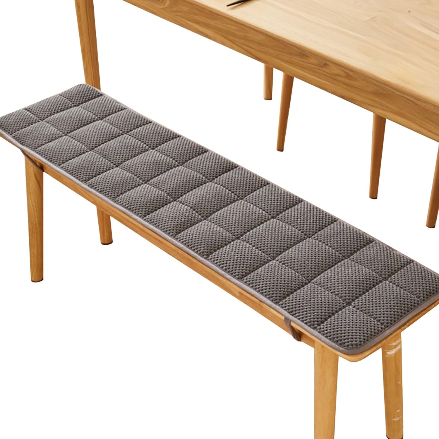 Coussin de banc gris pour balançoire créant un coin détente dans la véranda