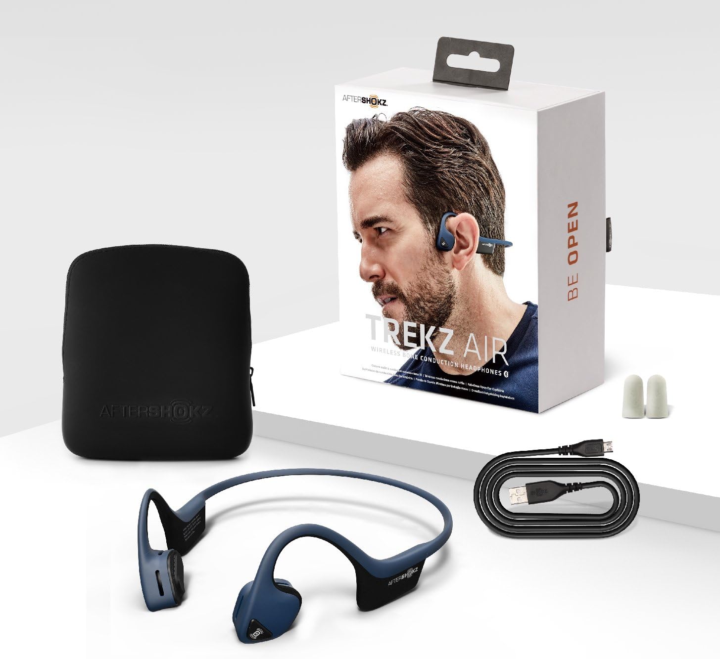 Female runner wearing AfterShokz Air headphones, with England Athletics logo