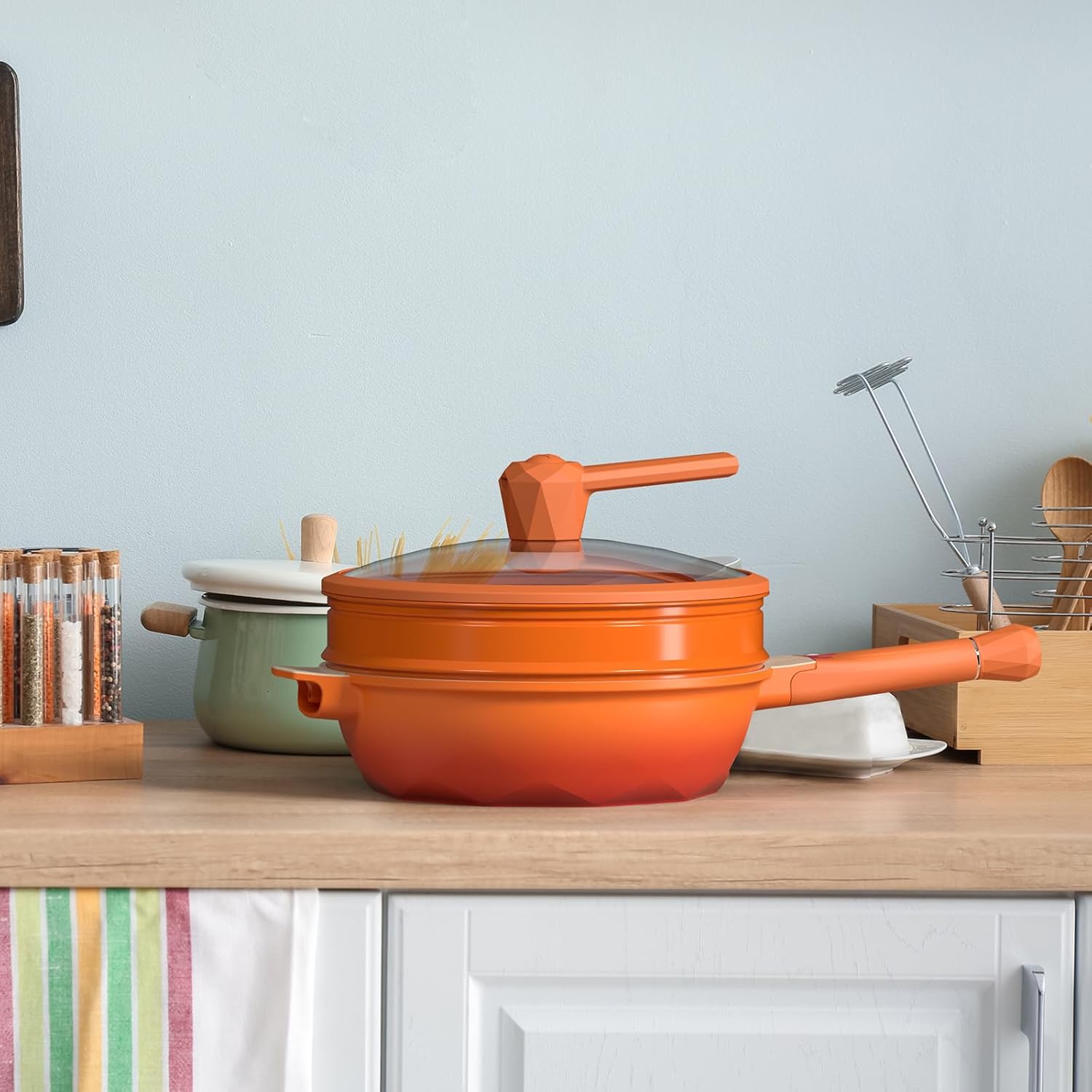 Orange Multipurpose Cookware Set on a Kitchen Counter