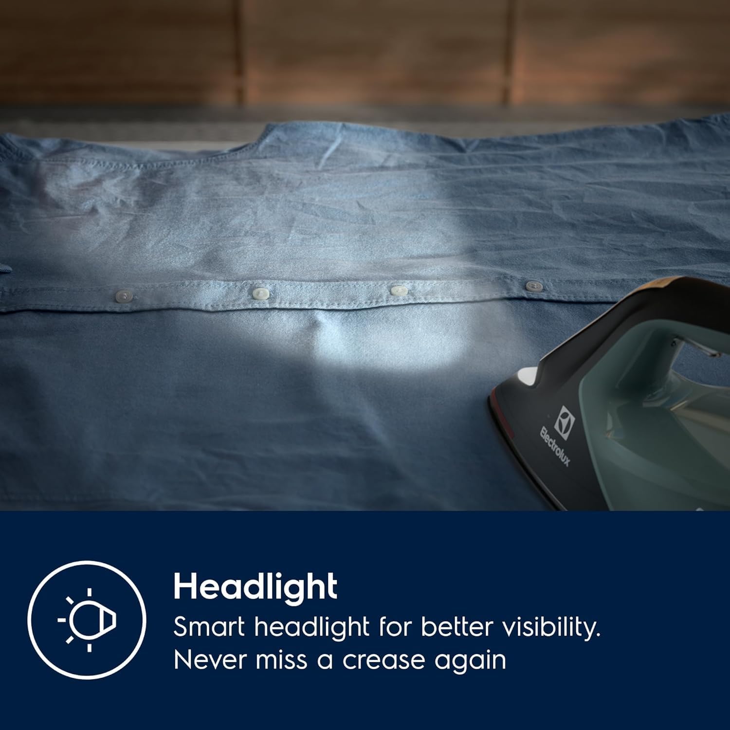 Hand pouring water into the Electrolux Renew 800 Steam Iron's water tank