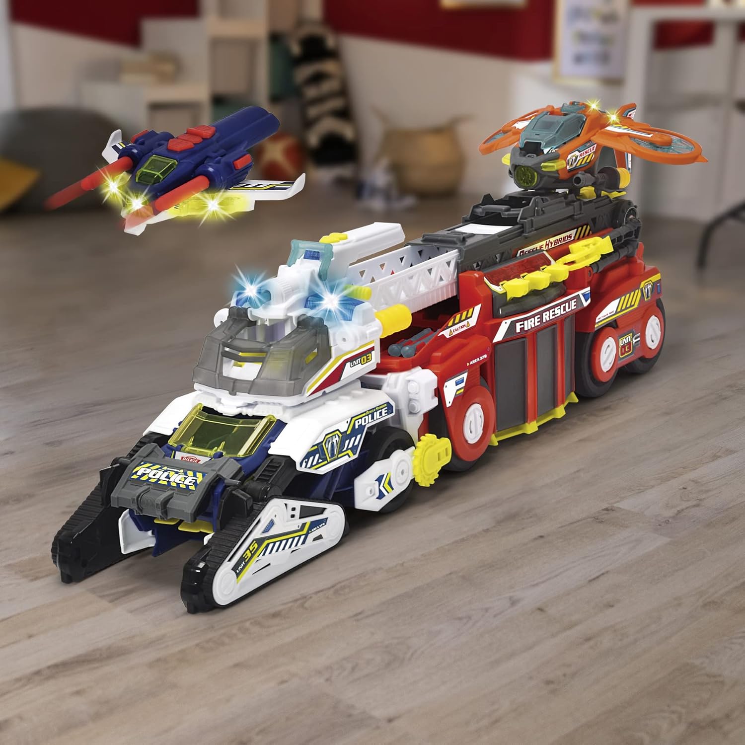 Image showing the Dickie Toys Police Bot in vehicle mode alongside a Dickie Toys Fire Rescue vehicle, demonstrating the Team Function synchronization feature.