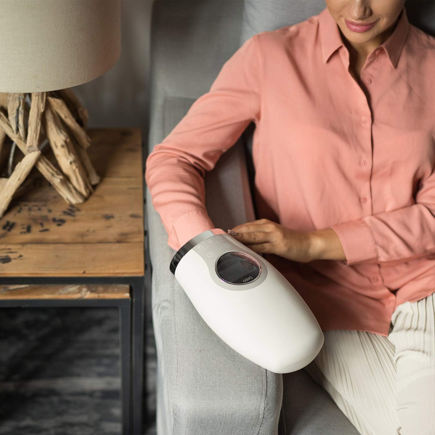 Person relaxing with Breo WOWOS Hand Massager