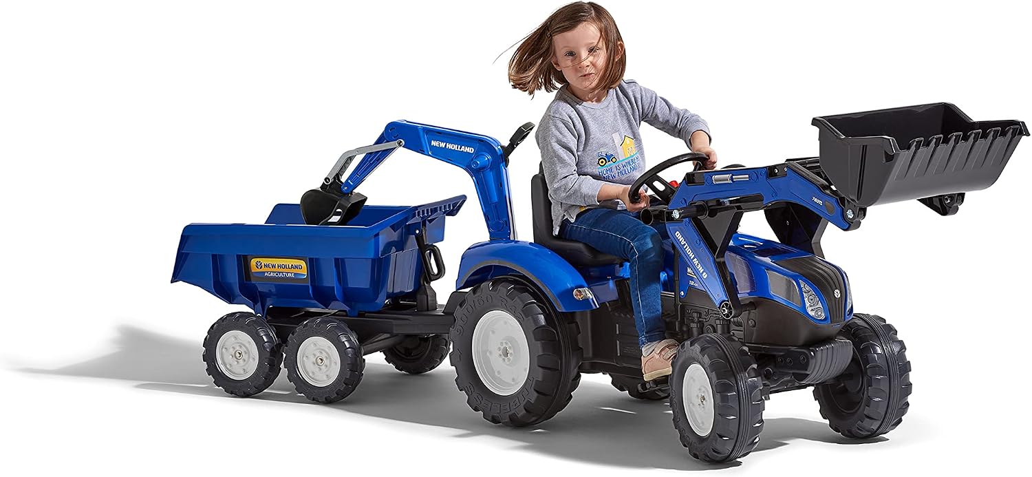 Child operating the front loader of the pedal tractor