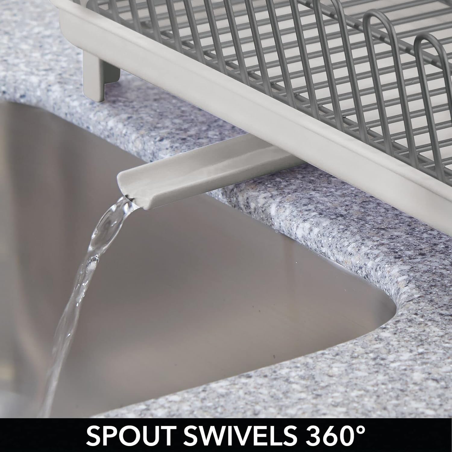 Close-up of the swivel spout draining water into a sink