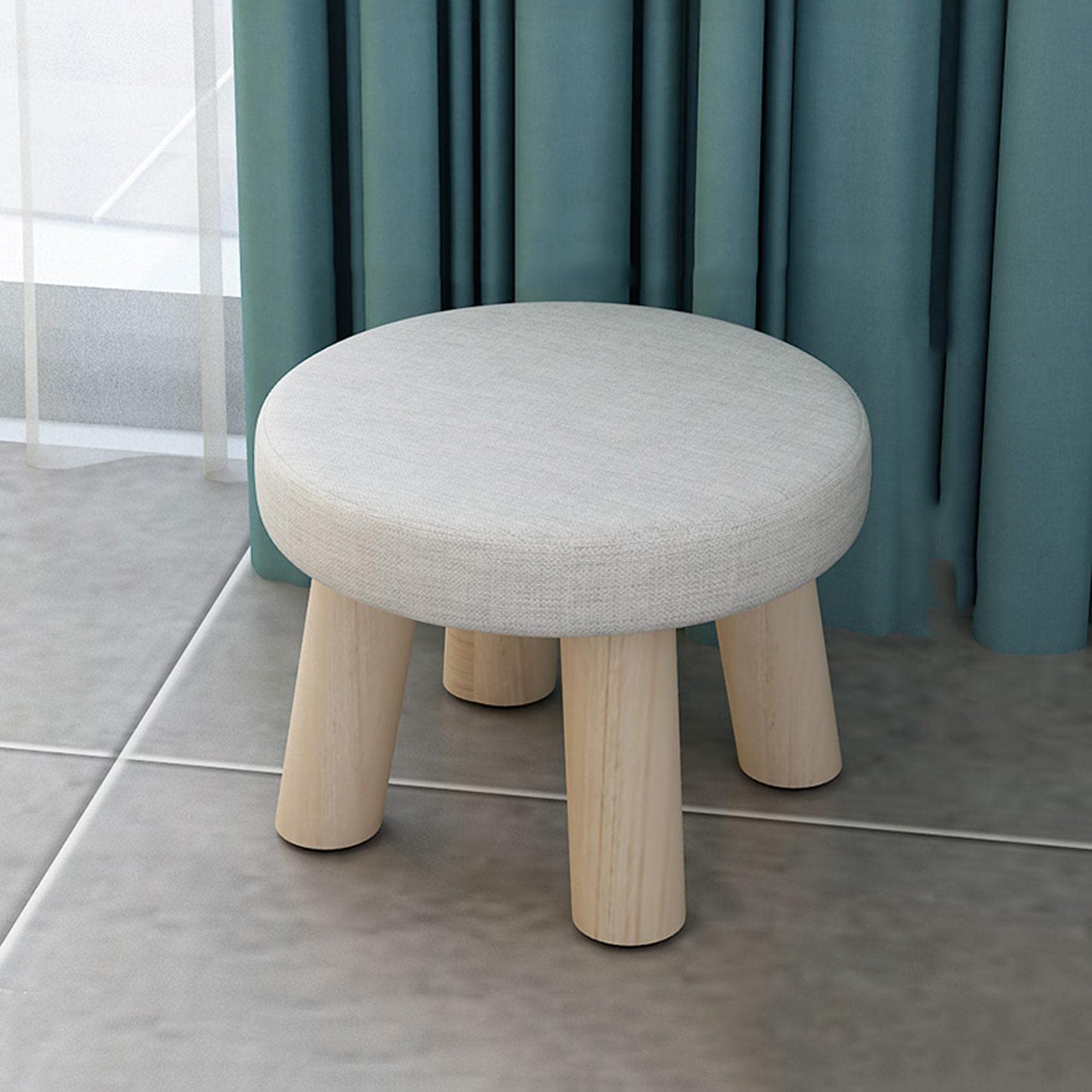 Pouf repose-pieds en lin pour créer un coin lecture cosy dans la chambre