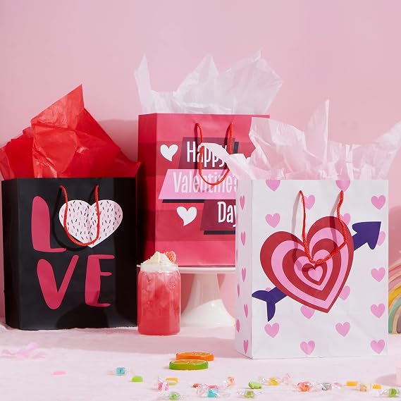 JOYIN 8 Pcs Valentines Day Paper Gift Bags,9.76 Gift Treat Bags with Filling Paper in 4 Designs, Candy Bag,Paper Wrapping Kraft Bags with Colorful Heart shaped Design for Kids Party Valentine Party Favors