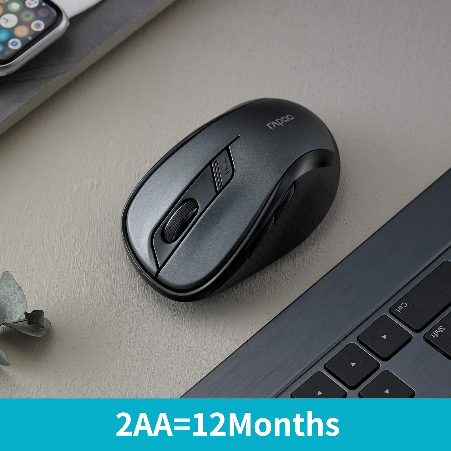 Rapoo M500 mouse on a desk with text '2AA=12Months' indicating battery life