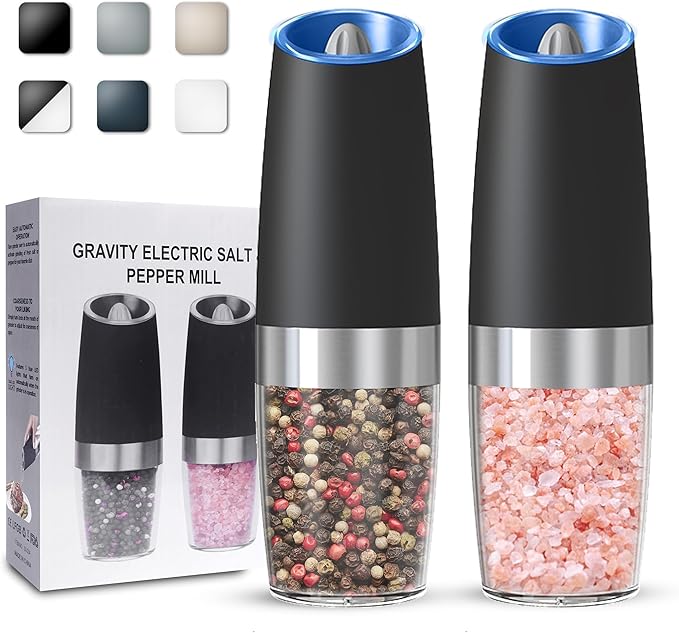 Two black and silver electric salt and pepper grinders