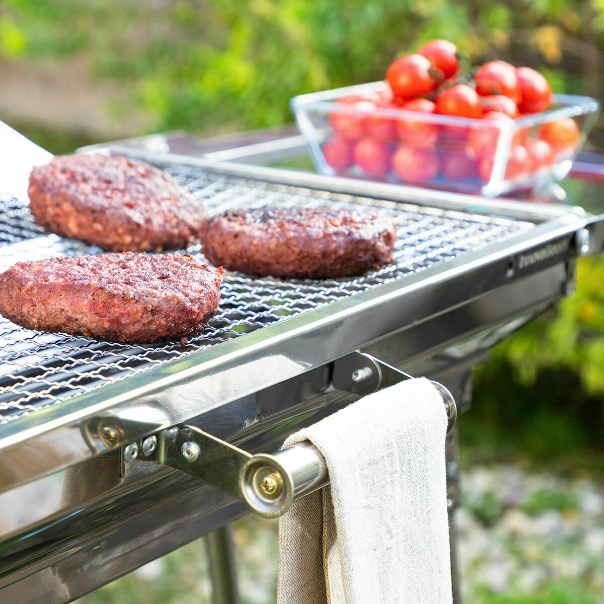 InnovaGoods® Barbecue carbone con tappetino per forno e barbecue, in acciaio inox per carbone, tappetino in fibra di vetro spazio cibo 57x29cm, ripiano laterale per accessori cucina