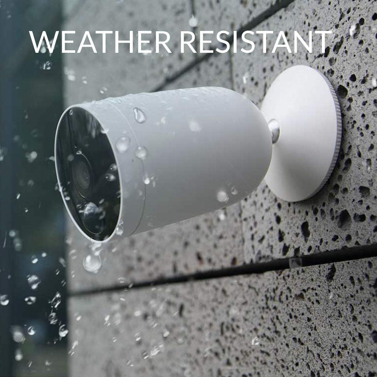 Kami Wire-Free Outdoor Camera being sprayed with water, demonstrating weather resistance