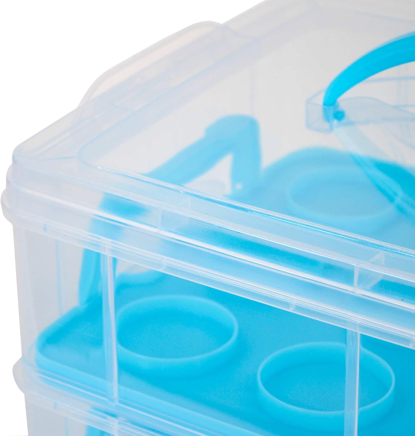 Close-up view of the top tier and blue carrying handle of the Oypla cupcake carrier.