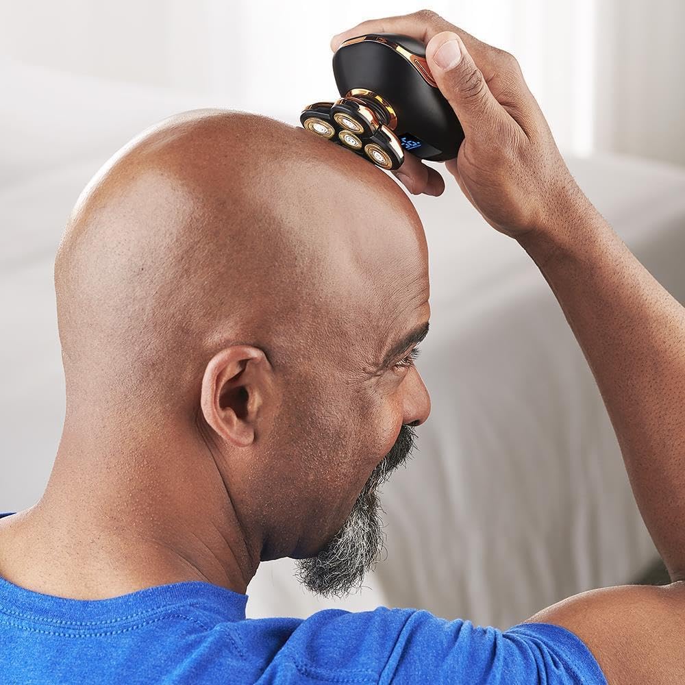 Man continuing to use Hammacher Schlemmer Head Shaver for a close shave