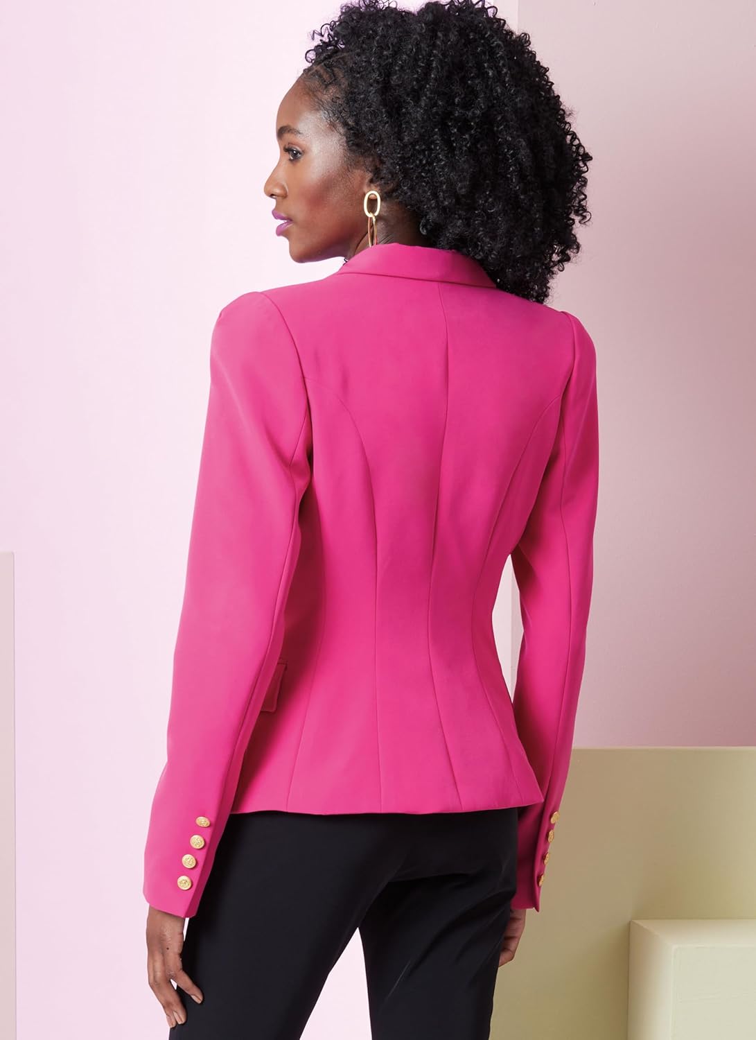 Back view of a model wearing the finished View A jacket in pink, highlighting the fitted silhouette and sleeve details.