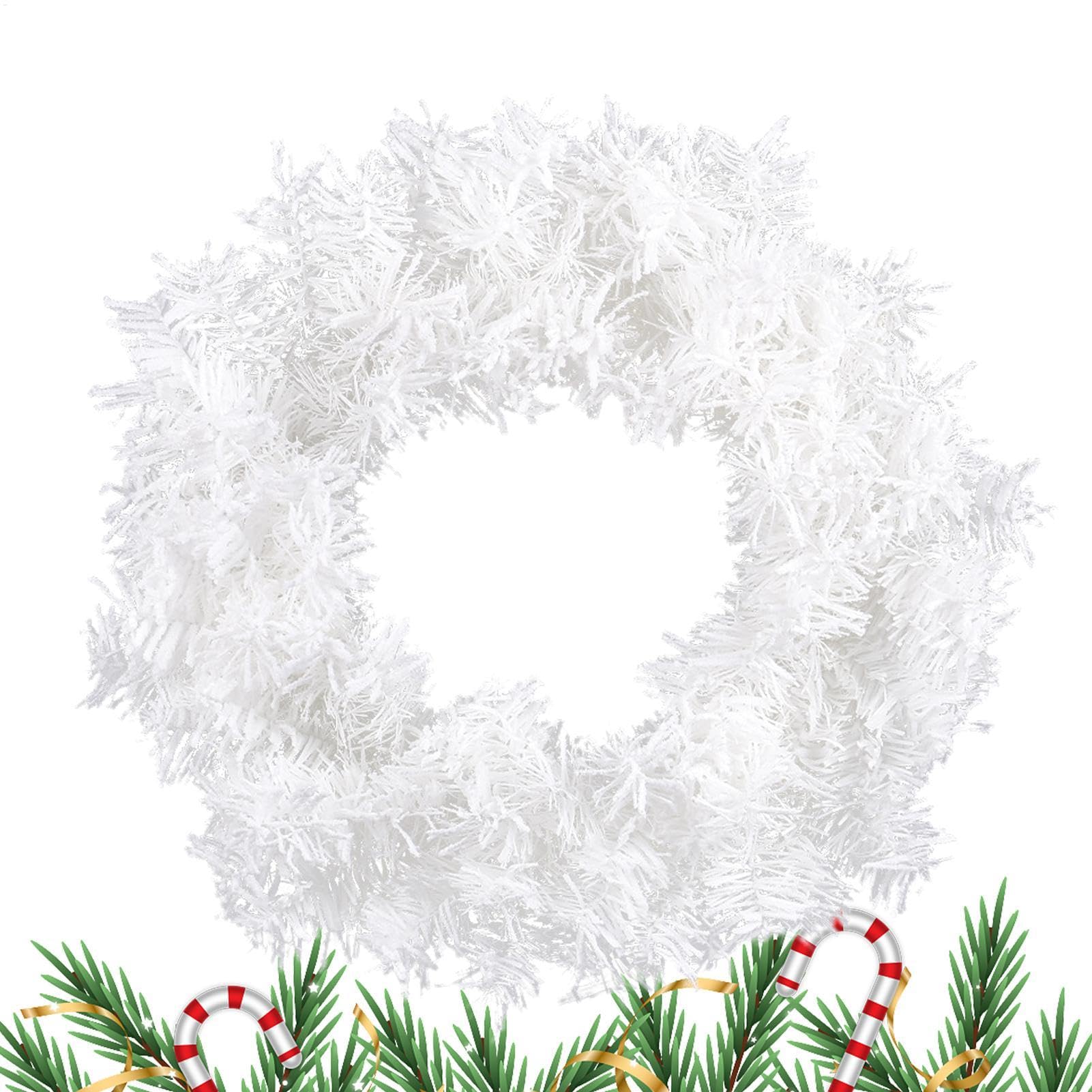 Couronne de Noël blanche pour sublimer une porte d'entrée et mur sombre