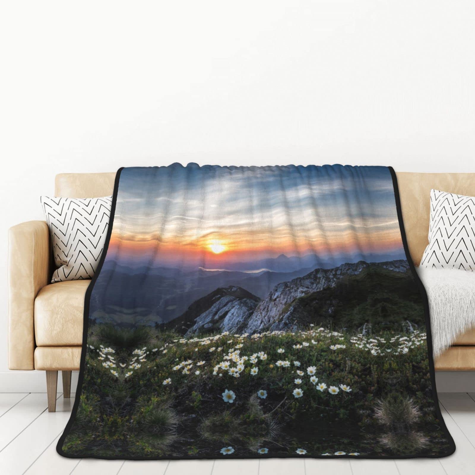 Plaid lit et canapé fleurs et coucher de soleil pour salon cocooning