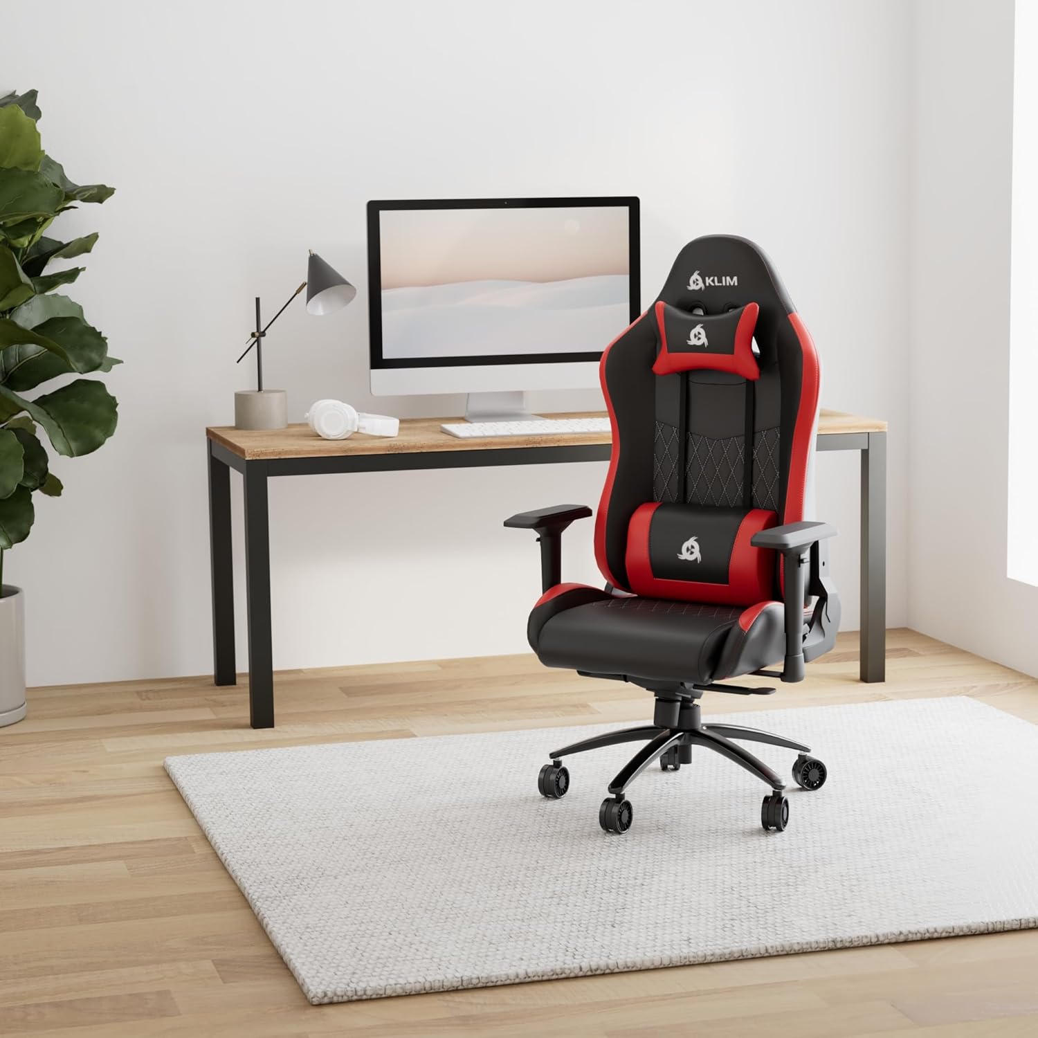 KLIM Esports Gaming Chair ER in a modern office setting with a desk and computer.