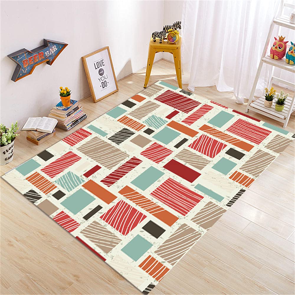 Tapis bébé fille doux aux motifs géométriques et design abstrait coloré