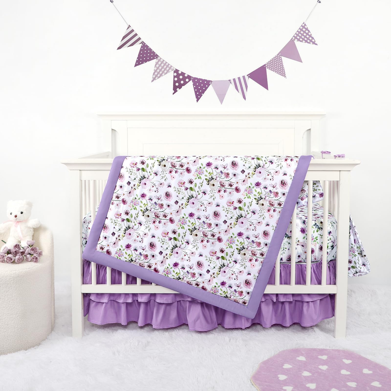 GFU Crib Bedding Set for Girls 4-Piece, Bow Baby Girl Crib Bedding Set Purple Flowes, Nursery Sets Includes Comforter, Fitted Crib Sheet, Crib Skirt, and Diaper Stacker