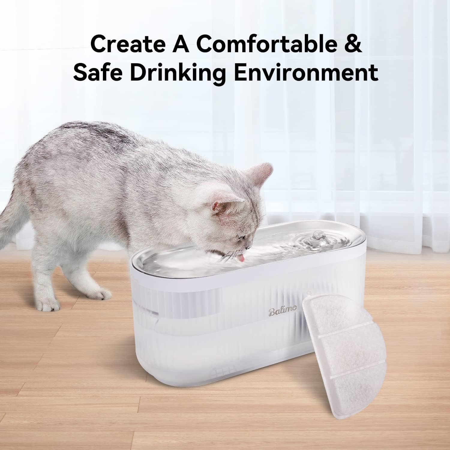 A cat drinking from a Balimo pet water fountain with filters nearby.