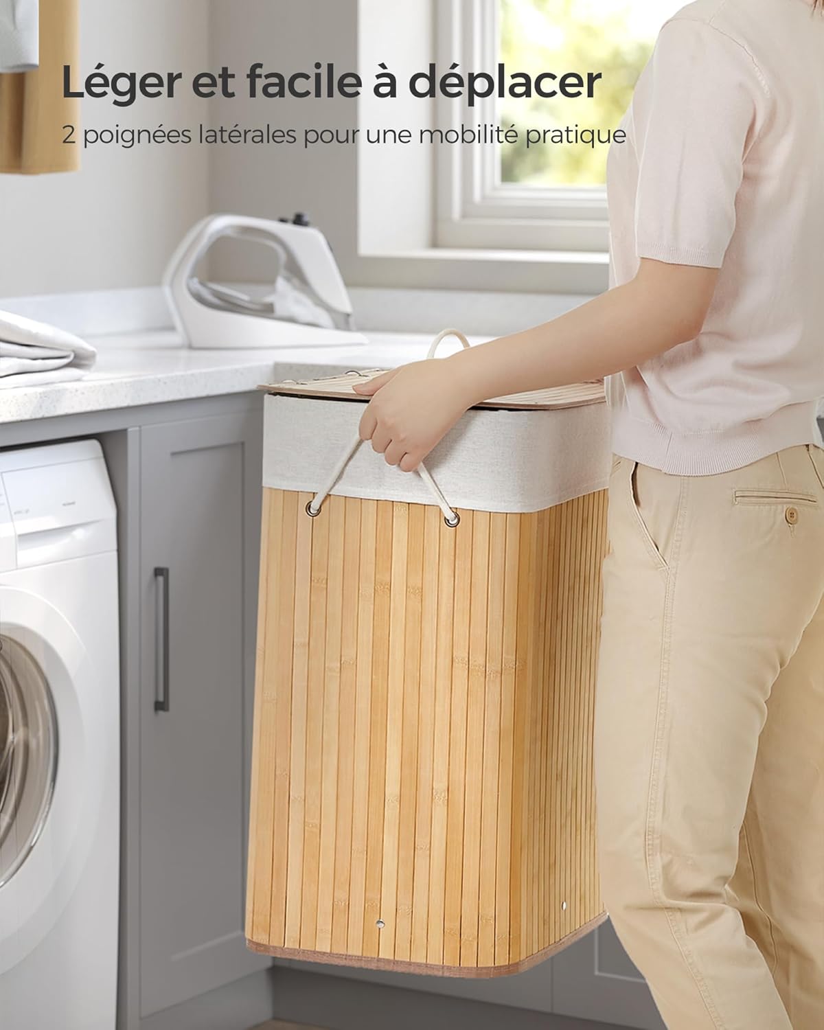 Person carrying laundry basket by its handles