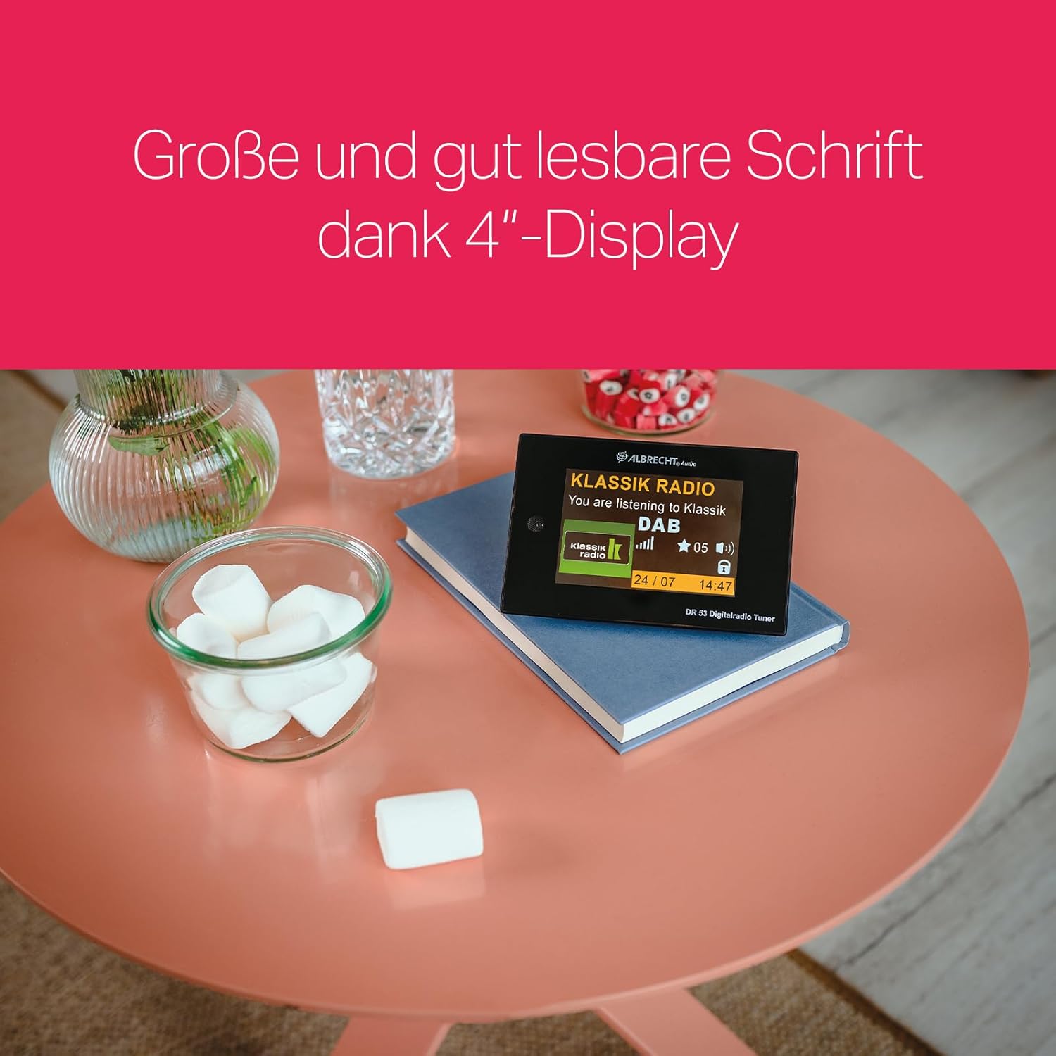 Albrecht DR53 tuner on a table, showing a clear 4-inch color display with readable text.