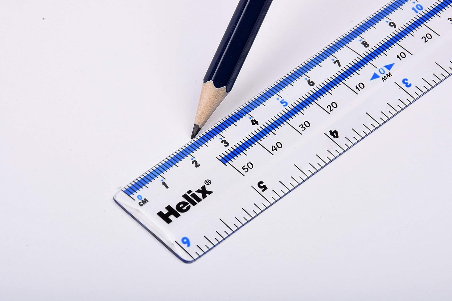 Helix ruler being used with a pencil to draw a line