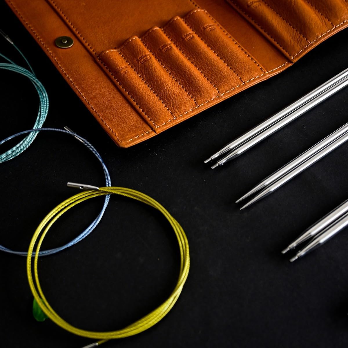 Lotus Yarns Interchangeable Circular Needles Set, 10 Pairs of 11.5cm (2.75-6.00mm) Stainless Steel Tips with 4 Swivel Cords, Accessroies in an Orange Leather Case
