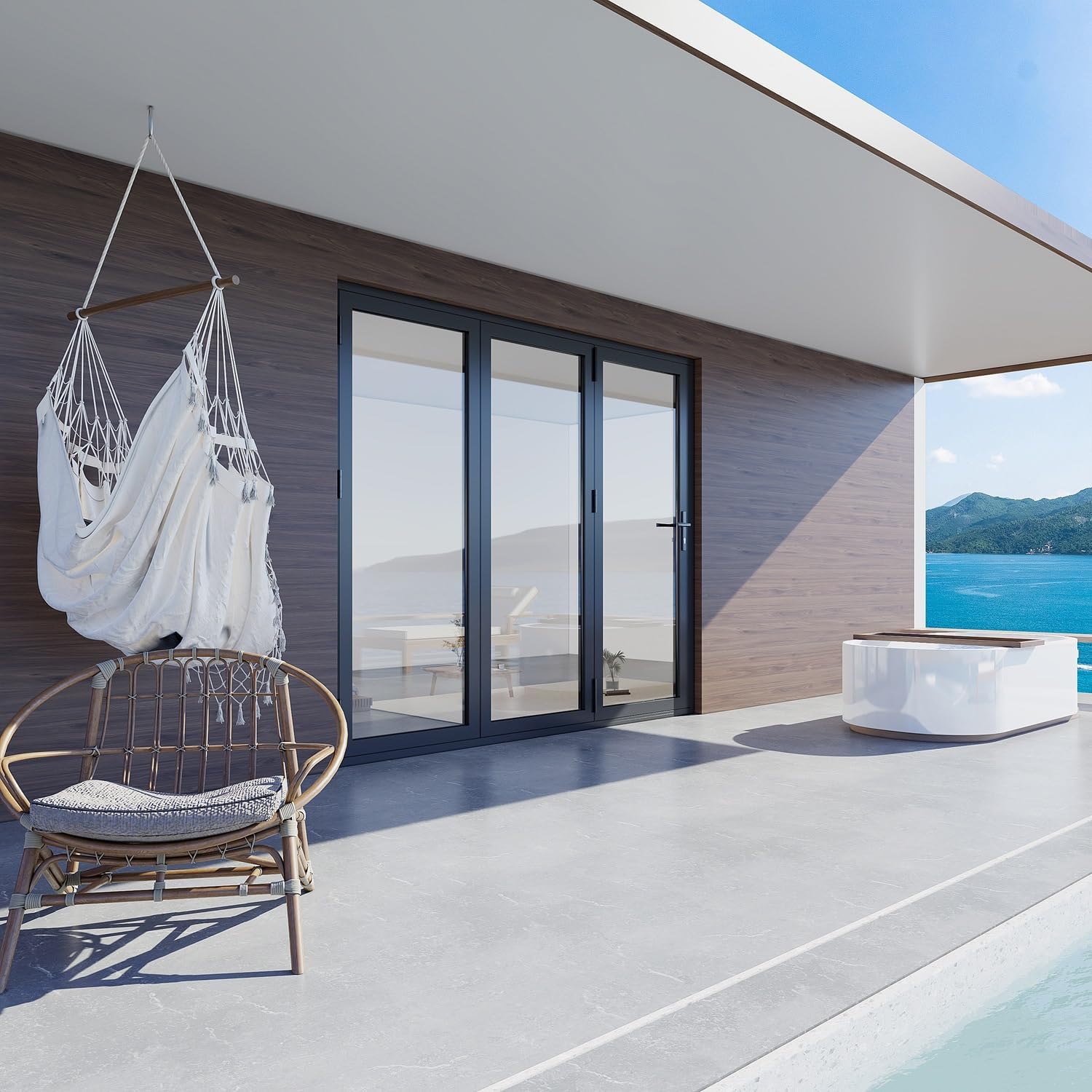 KaMic 3-panel aluminum folding door closed, providing a clear view of an outdoor patio with ocean view.