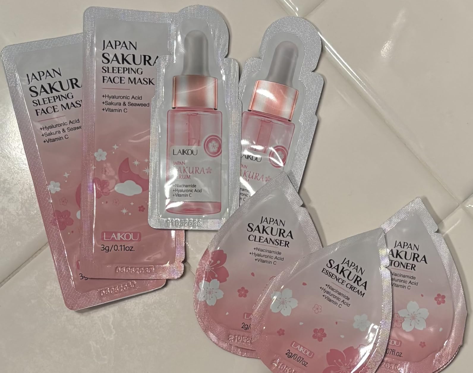 Yasovigi Sakura Travel Skincare Sets, 60pcs Mini Travel Skin Care kit Including Cleanser, Toner, Lotion, Serum, Cream, Sleepping Mask