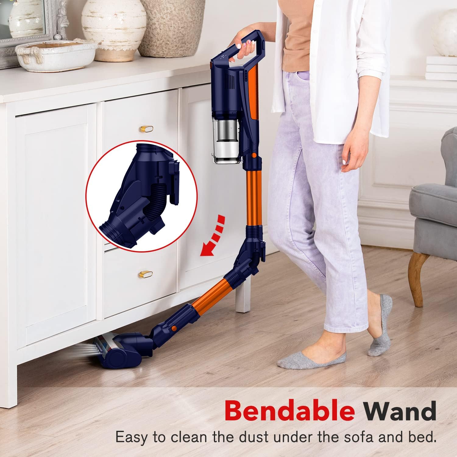 Woman using the Fochai cordless vacuum cleaner with its bendable wand to clean under a cabinet.