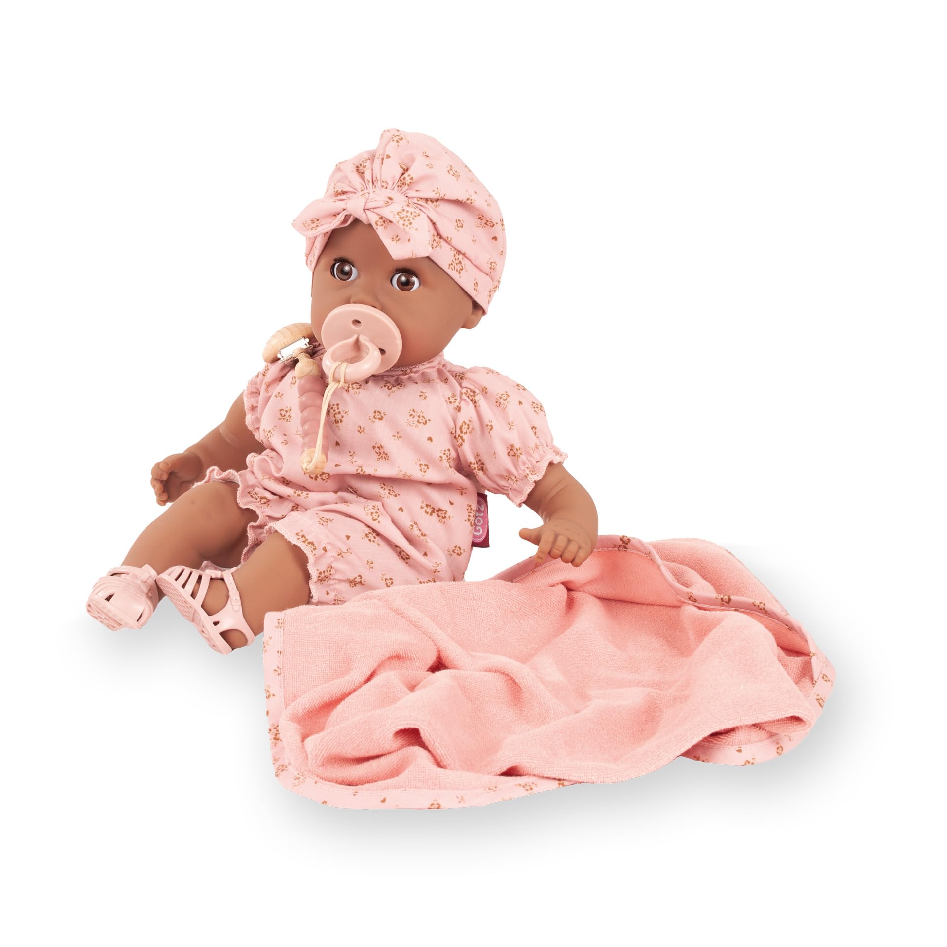 Götz 2616875 Cosy Aquini Millefleur Puppe 33 cm Badepuppe 8-TLG | für Kinder ab 3 Jahren, Babypuppe, ohne Haare, Weichkörper, braune Schlafaugen, Schnuller und Badetuch