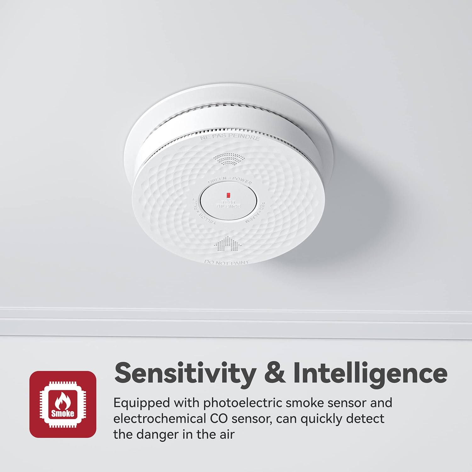 Woman pressing the silence button on the smoke detector mounted on a wall.
