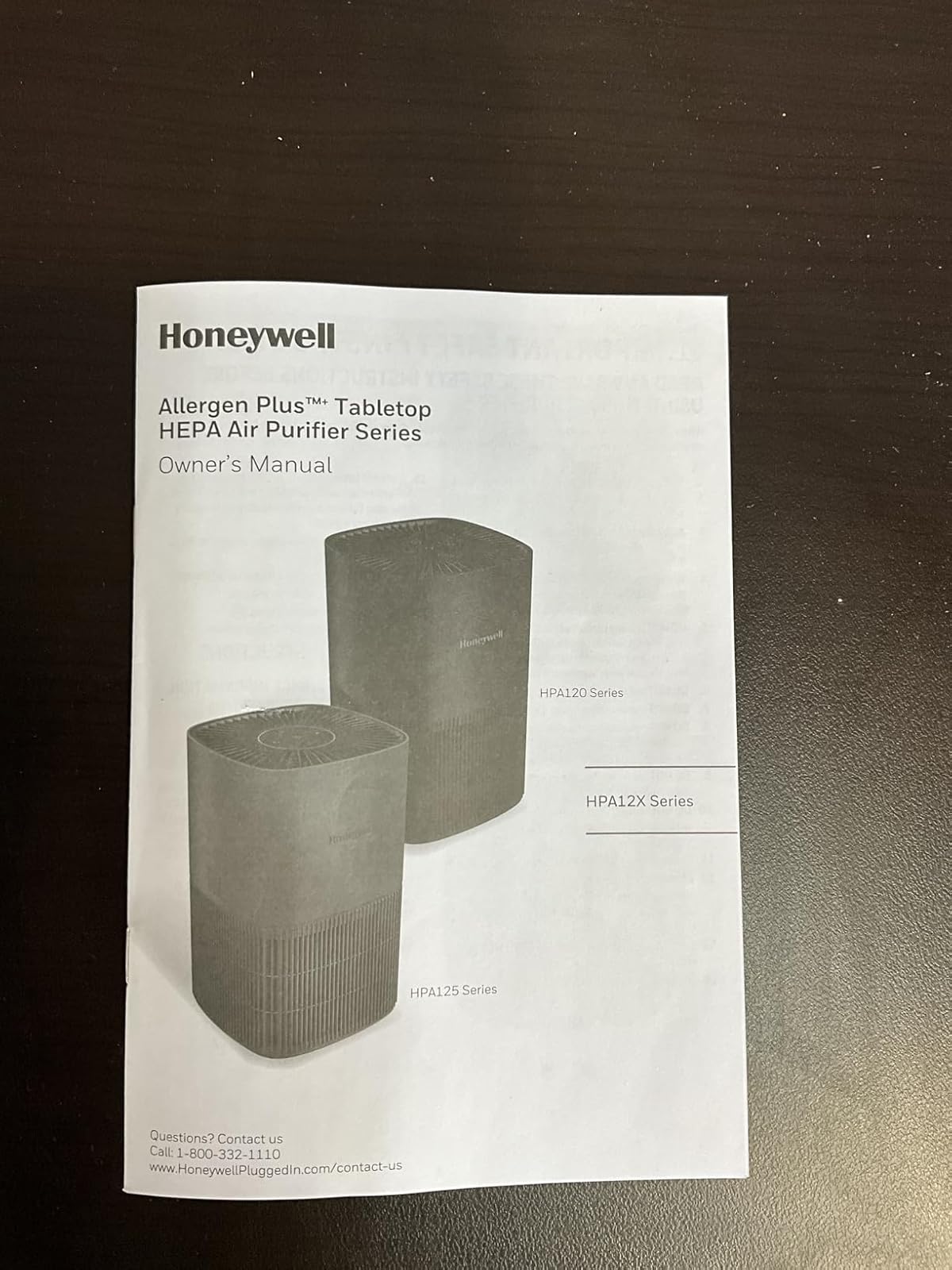 Honeywell AllergenPlus HPA125 in black color on office desk showing LED indicator