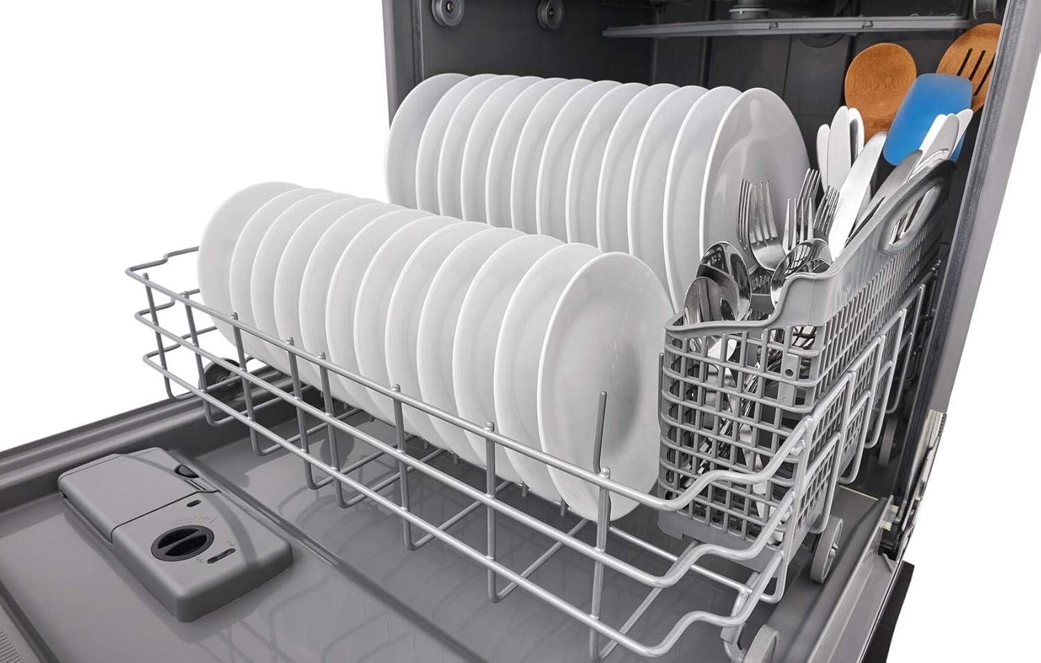 Lower rack of the Frigidaire FFID2426TD dishwasher loaded with plates and silverware.