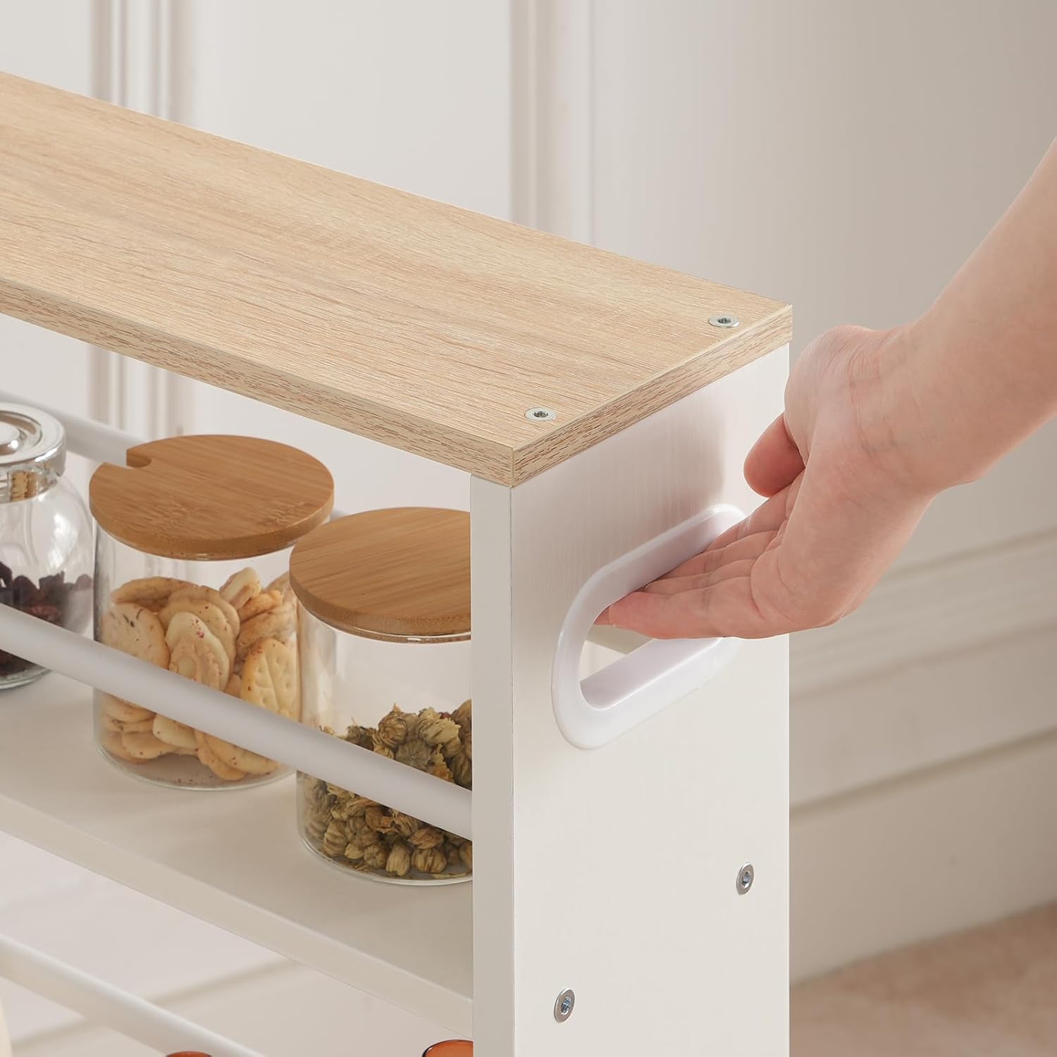 A hand gripping the integrated handle on the side of the HOOBRO service cart.