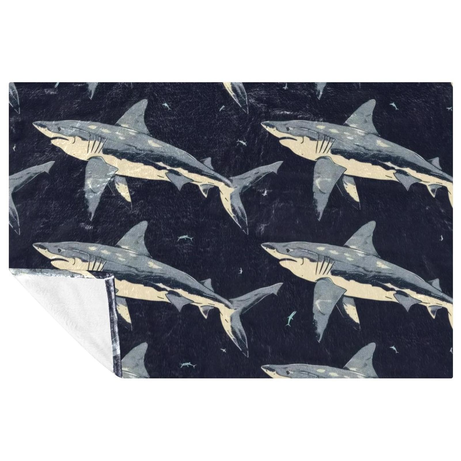 Couverture douce requins contre le froid sur le lit ou le canapé
