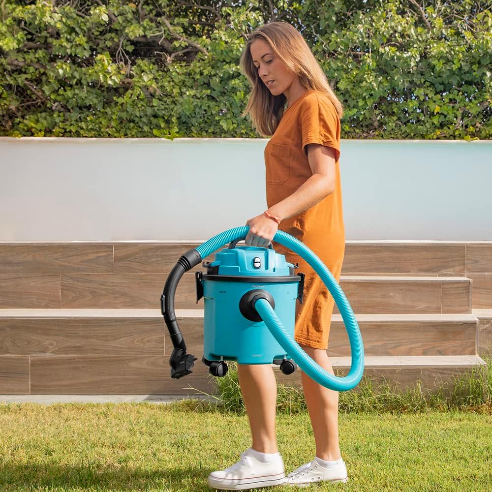 Woman carrying the Cecotec Conga Rockstar Wet & Dry Compact Garden Plus Vacuum Cleaner, highlighting its portability